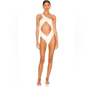 Asymmetrical crossover one piece. Off white color. Size medium